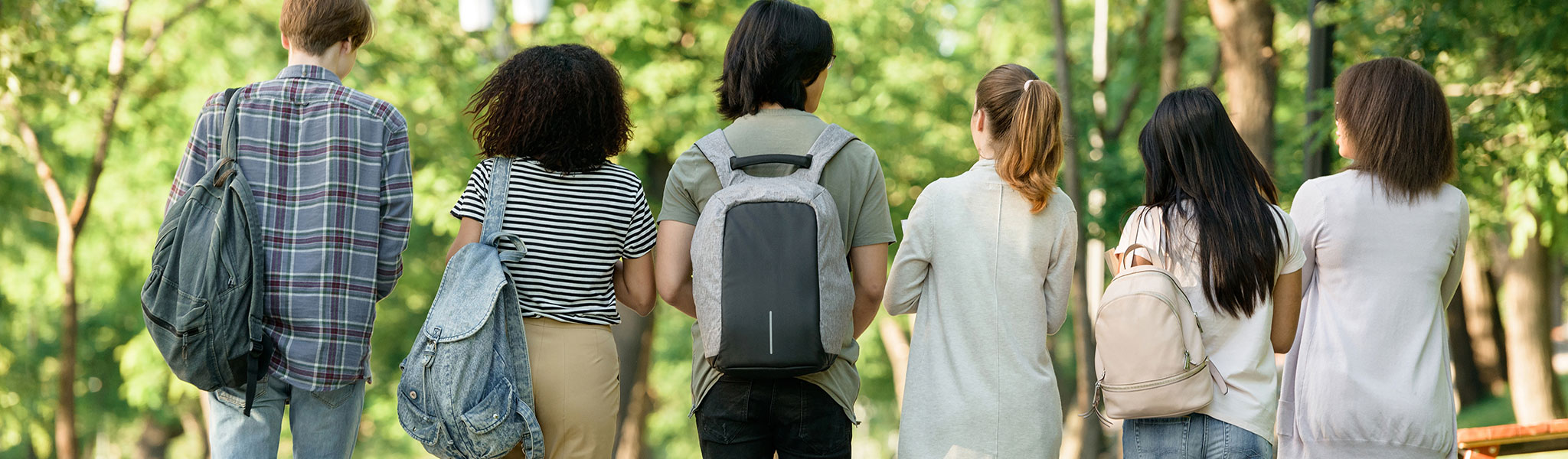 Back view image of multiethnic group of young students